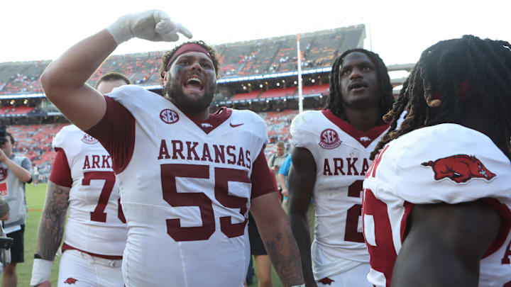 Sep 21, 2024; Auburn, Alabama, USA;  Arkansas Razorbacks offensive lineman Fernando Carmona (55) celebrates with fans after the Razorbacks beat the Auburn Tigers at Jordan-Hare Stadium. Mandatory Credit: John Reed-Imagn Images