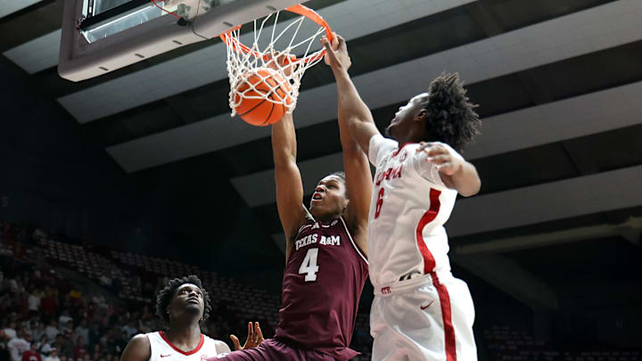 Feb 4, 2026; Tuscaloosa, Alabama, USA; Texas A&M Aggies forward Jamie Vinson (4) dunks against Alabama Crimson Tide forward London Jemison (6) during the first half at Coleman Coliseum. Mandatory Credit: David Leong-Imagn Images