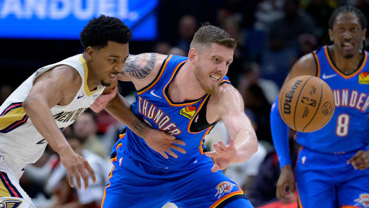 Dec 7, 2024; New Orleans, Louisiana, USA;  Oklahoma City Thunder center Isaiah Hartenstein (55) steals the ball from New Orleans Pelicans guard Trey Murphy III (25) during the first half at Smoothie King Center.