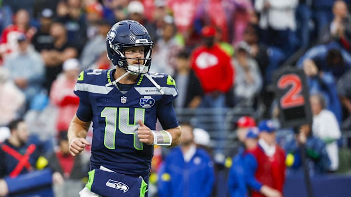 Seattle Seahawks quarterback Sam Darnold (14) reacts following a rushing touchdown by a teammate against the Kansas City Chiefs