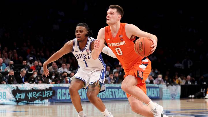 Mar 10, 2022; Brooklyn, NY, USA; Syracuse Orange forward Jimmy Boeheim (0) drives to the basket against Duke Blue Devils guard Trevor Keels (1) during the second half at Barclays Center. Mandatory Credit: Brad Penner-Imagn Images Mar 10, 2022; Brooklyn, NY, USA; Syracuse Orange forward Jimmy Boeheim (0) drives to the basket against Duke Blue Devils guard Trevor Keels (1) during the second half at Barclays Center. Mandatory Credit: Brad Penner-Imagn Images