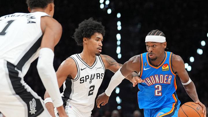 Oct 20, 2026; San Antonio, Texas, USA; Oklahoma City Thunder guard Shai Gilgeous-Alexander (2) dribbles against San Antonio Spurs guard Dylan Harper (2) in the first half at Frost Bank Center. Mandatory Credit: Daniel Dunn-Imagn Images Oct 20, 2026; San Antonio, Texas, USA; Oklahoma City Thunder guard Shai Gilgeous-Alexander (2) dribbles against San Antonio Spurs guard Dylan Harper (2) in the first half at Frost Bank Center. Mandatory Credit: Daniel Dunn-Imagn Images