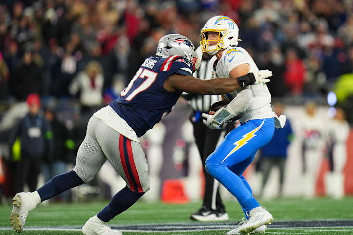 Jan 11, 2026; Foxborough, MA, USA; New England Patriots defensive end Milton Williams (97) sacks Los Angeles Chargers quarter