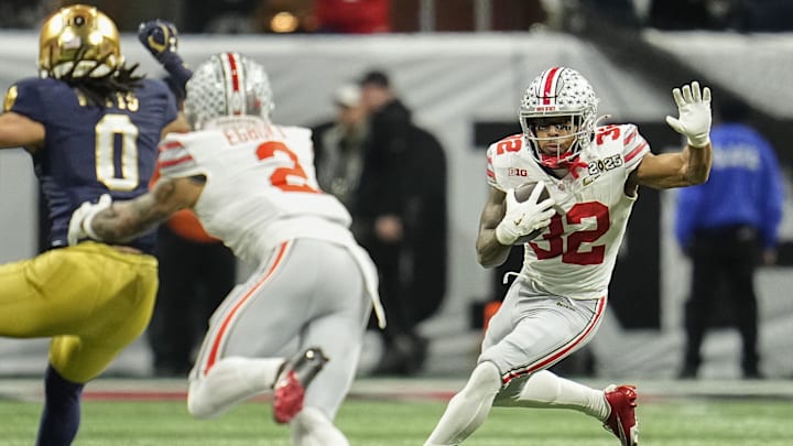 Ohio State Buckeyes running back TreVeyon Henderson (32) runs during the College Football Playoff National Championship against the Notre Dame Fighting Irish at Mercedes-Benz Stadium in Atlanta on Jan. 22, 2025.