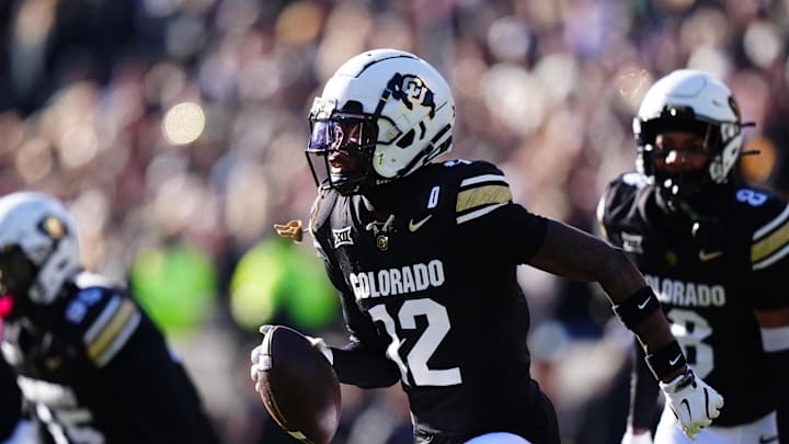 Nov 29, 2024; Boulder, Colorado, USA; Colorado Buffaloes cornerback Travis Hunter (12) following an interception in the first quarter against the Oklahoma State Cowboys  at Folsom Field. Mandatory Credit: Ron Chenoy-Imagn Images