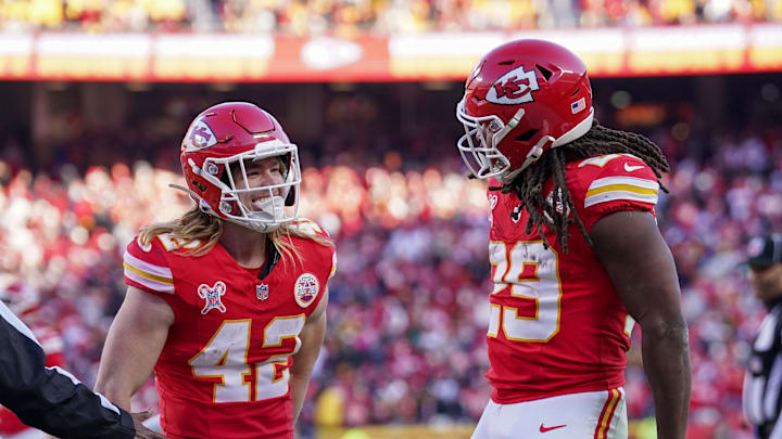 Dec 21, 2024; Kansas City, Missouri, USA; Kansas City Chiefs running back Kareem Hunt (29) celebrates with running back Carson Steele (42) after a play against the Houston Texans during the second half at GEHA Field at Arrowhead Stadium. Mandatory Credit: Denny Medley-Imagn Images