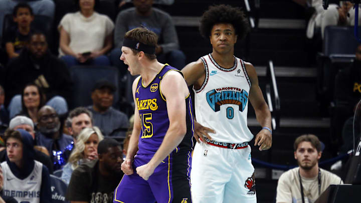 Mar 29, 2025; Memphis, Tennessee, USA; Los Angeles Lakers guard Austin Reaves (15) reacts after a basket during the fourth quarter against the Memphis Grizzlies at FedExForum. Mandatory Credit: Petre Thomas-Imagn Images