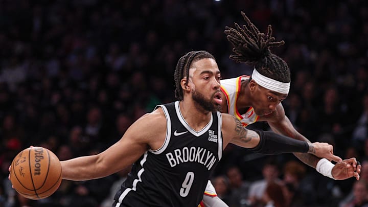 Mar 16, 2025; Brooklyn, New York, USA; Brooklyn Nets forward Trendon Watford (9) drives to the basket against Atlanta Hawks guard Terance Mann (14) during the second half at Barclays Center. Mandatory Credit: Vincent Carchietta-Imagn Images