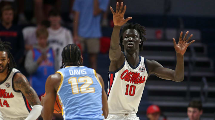 Nov 4, 2024; Oxford, Mississippi, USA; Mississippi Rebels forward John Bol (10) defends Long Island Sharks guard Brent Davis (12) during the second half at The Sandy and John Black Pavilion at Ole Miss. Mandatory Credit: Petre Thomas-Imagn Images