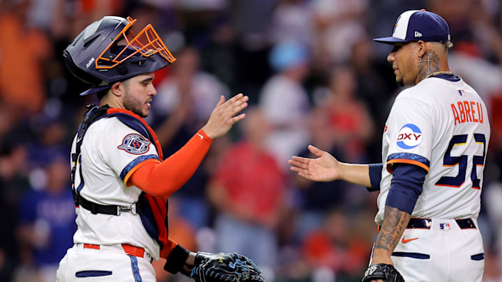 Sep 15, 2025; Houston, Texas, USA; Houston Astros pitcher Bryan Abreu (52) celebrates with Houston Astros catcher Yainer Diaz (21, left) after the final out against the Texas Rangers during the ninth inning at Daikin Park.