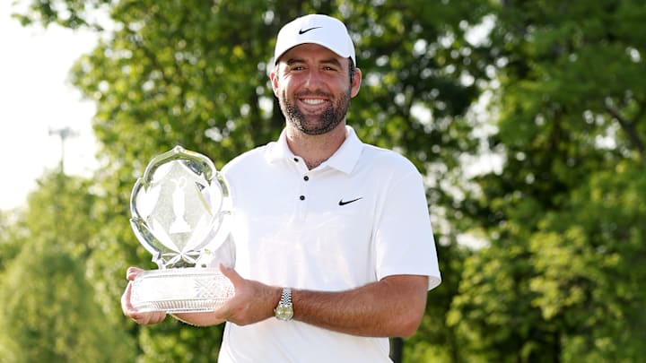 Scottie Scheffler poses with the winner's trophy following his victory at the 2025 Memorial Tournament at Muirfield Village