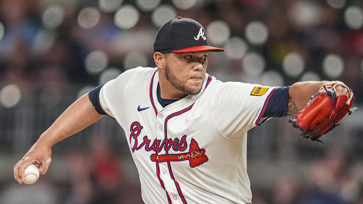 Sep 4, 2024; Cumberland, Georgia, USA; Atlanta Braves pitcher Joe Jimenez (77) pitches against the Colorado Rockies during the eighth inning at Truist Park. Mandatory Credit: Dale Zanine-Imagn Images