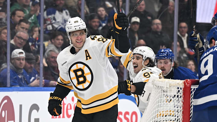 Nov 8, 2025; Toronto, Ontario, CAN;  Boston Bruins forward David Pastrnak (88) celebrates with forward Marat Khusnutdinov (92)after scoring a goal against the Toronto Maple Leafs in the second period at Scotiabank Arena. Mandatory Credit: Dan Hamilton-Imagn Images