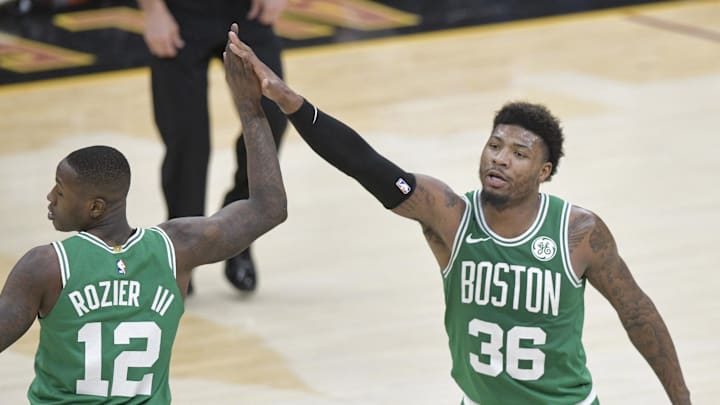 Feb 5, 2019; Cleveland, OH, USA; Boston Celtics guard Terry Rozier (12) and guard Marcus Smart (36) celebrate against the Cleveland Cavaliers in the fourth quarter at Quicken Loans Arena. Mandatory Credit: David Richard-Imagn Images