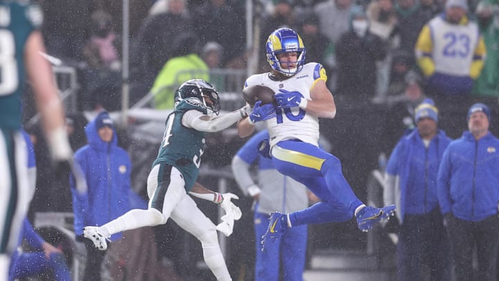 Jan 19, 2025; Philadelphia, Pennsylvania, USA; Los Angeles Rams wide receiver Cooper Kupp (10) catches the ball as Philadelphia Eagles cornerback Isaiah Rodgers (34) defends in a 2025 NFC divisional round game at Lincoln Financial Field. Mandatory Credit: Bill Streicher-Imagn Images