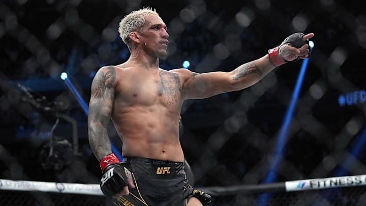 Charles Oliveira celebrates his victory.