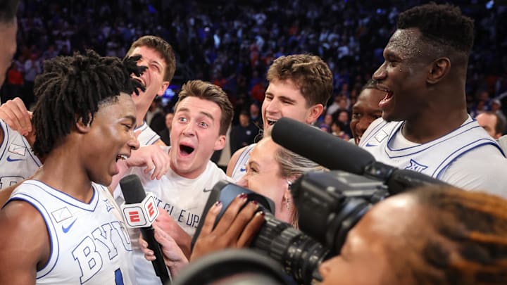 Dec 9, 2025; New York, New York, USA;  BYU Cougars guard Robert Wright III (1) celebrates with his teammates after hiting a game winning three point shot to beat the Clemson Tigers 67-64 at Madison Square Garden. Mandatory Credit: Wendell Cruz-Imagn Images