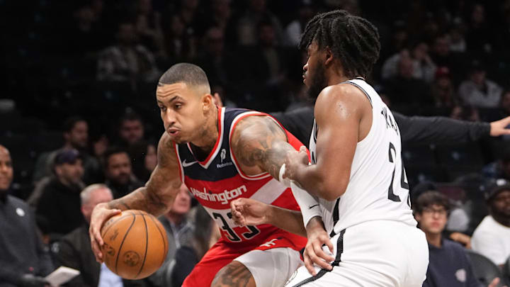 Oct 14, 2024; Brooklyn, New York, USA; Washington Wizards small forward Kyle Kuzma (33) dribbles the ball against Brooklyn Nets small guard Cam Thomas (24) during the second half at Barclays Center. Mandatory Credit: Gregory Fisher-Imagn Images