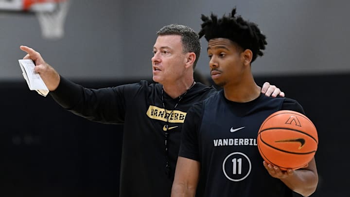 Vanderbilt head coach Mark Byington goes over a drill with guard A.J. Hoggard (11)during an NCAA college basketball practice Tuesday, October 8, 2024, in Nashville, Tenn.