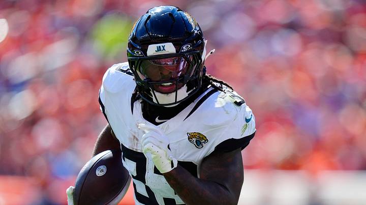 Sep 20, 2026; Denver, Colorado, USA;  Jacksonville Jaguars running back Bhayshul Tuten (33) rushes the ball against the Denver Broncos in the first half at Empower Field at Mile High.  Mandatory Credit: Ron Chenoy-Imagn Images