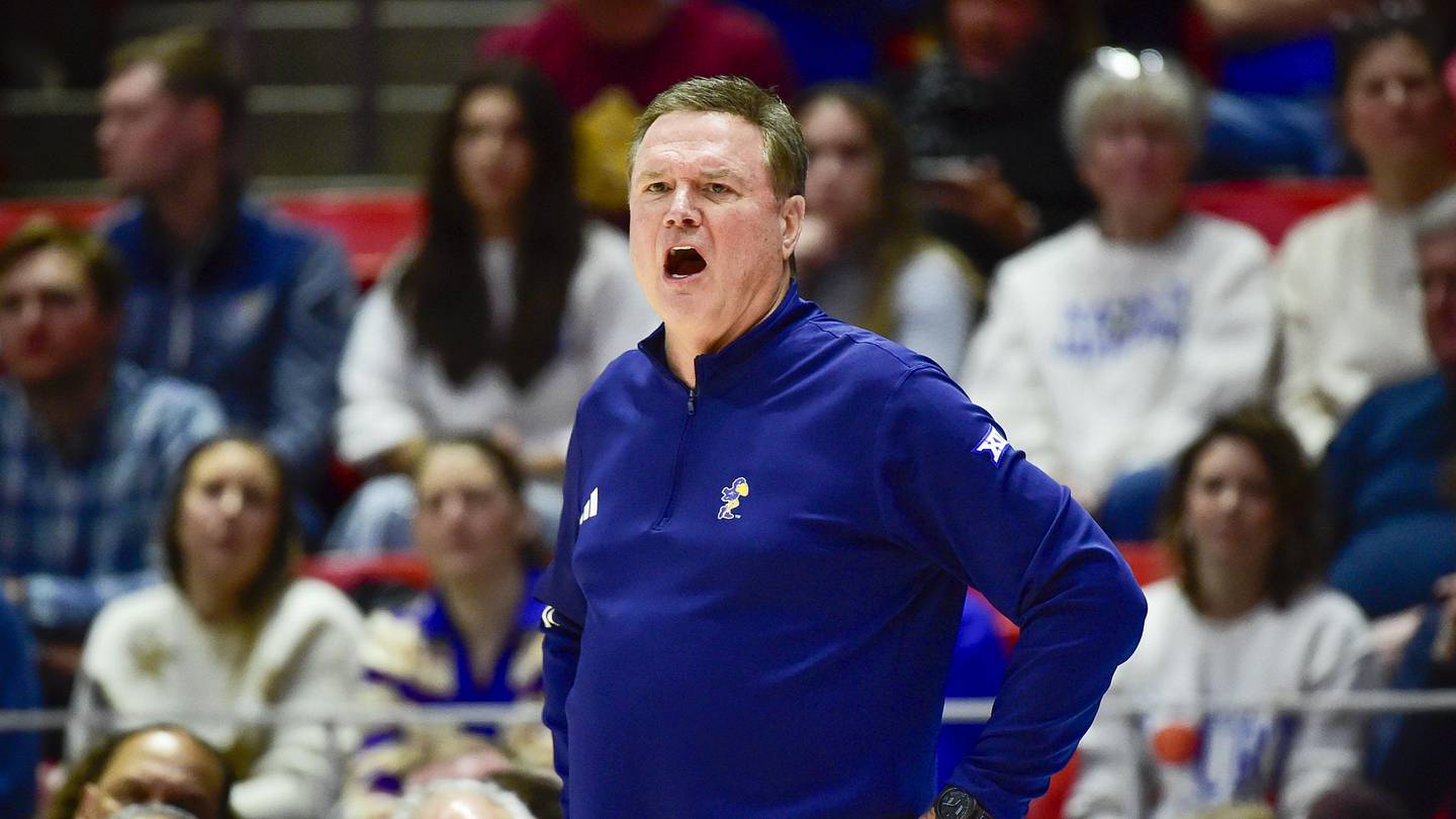 Jayhawks Face Crisis; Woodson Steps Down at Indiana