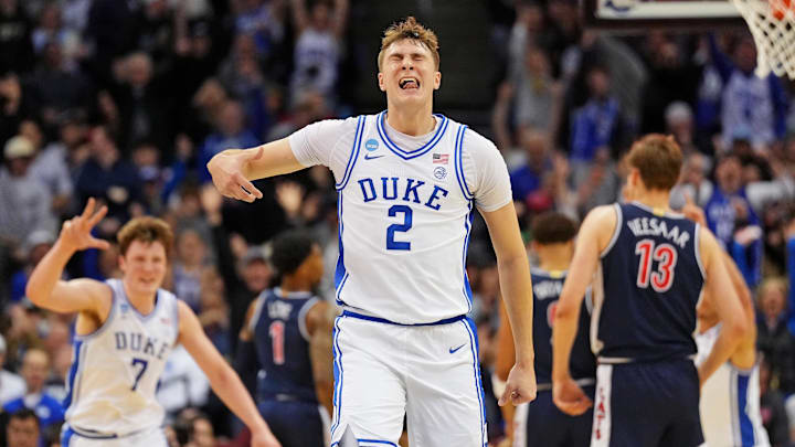 Mar 27, 2025; Newark, NJ, USA; Duke Blue Devils forward Cooper Flagg (2) reacts after making a last second shot to end the first half against the Arizona Wildcats during an East Regional semifinal of the 2025 NCAA tournament at Prudential Center. Mandatory Credit: Robert Deutsch-Imagn Images Mar 27, 2025; Newark, NJ, USA; Duke Blue Devils forward Cooper Flagg (2) reacts after making a last second shot to end the first half against the Arizona Wildcats during an East Regional semifinal of the 2025 NCAA tournament at Prudential Center. Mandatory Credit: Robert Deutsch-Imagn Images