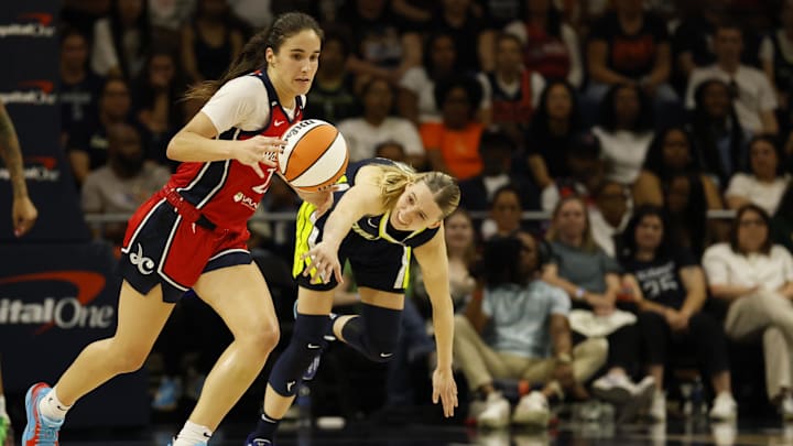 Jun 22, 2025; Washington, District of Columbia, USA; Washington Mystics guard Sonia Citron (22) steals the ball from Dallas Wings guard Paige Bueckers (5) in the second half at Entertainment & Sports Arena. Mandatory Credit: Geoff Burke-Imagn Images