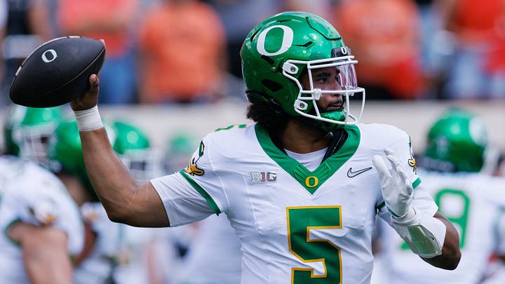 Sep 12, 2026; Stillwater, Oklahoma, USA;  Oregon Ducks quarterback Dante Moore (5) throws a pass during the first quarter against the Oklahoma State Cowboys at Boone Pickens Stadium.  Mandatory Credit: William Purnell-Imagn Images