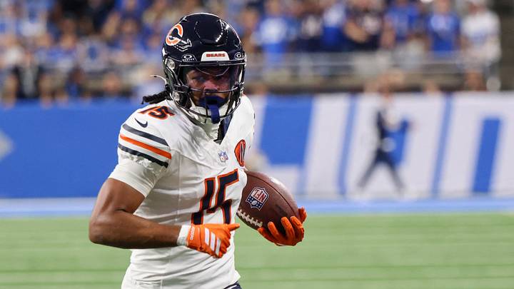 Chicago Bears wide receiver Rome Odunze (15) carries the ball for a touchdown against the Detroit Lions during the first quarter at Ford Field. Mandatory Credit: David Reginek-Imagn Images