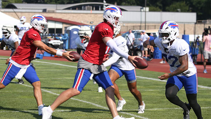 Bills quarterback Josh Allen hands off to running back Ray Davis during position drills during day five of Buffalo Bills training camp at St. John Fisher University Monday, July 28, 2025 in Pittsford, NY.