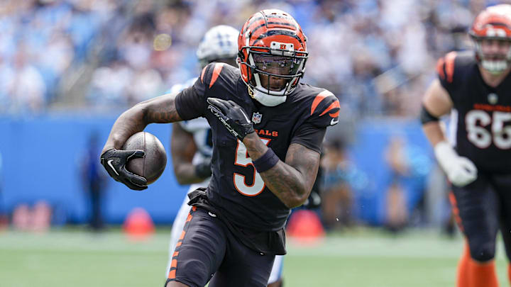 Sep 29, 2024; Charlotte, North Carolina, USA; Cincinnati Bengals wide receiver Tee Higgins (5) runs with the ball against the Carolina Panthers during 1st quarter at Bank of America Stadium. Mandatory Credit: Jim Dedmon-Imagn Images