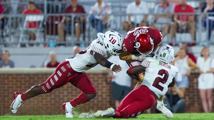 Aug 30, 2024; Norman, Oklahoma, USA; Temple Owls linebacker Tyquan King (10) and Temple Owls safety Andreas Keaton (2) tackle Oklahoma Sooners tight end Bauer Sharp (10) during the second half at Gaylord Family-Oklahoma Memorial Stadium. Mandatory Credit: Kevin Jairaj-Imagn Images Aug 30, 2024; Norman, Oklahoma, USA; Temple Owls linebacker Tyquan King (10) and Temple Owls safety Andreas Keaton (2) tackle Oklahoma Sooners tight end Bauer Sharp (10) during the second half at Gaylord Family-Oklahoma Memorial Stadium. Mandatory Credit: Kevin Jairaj-Imagn Images