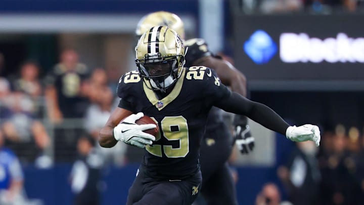 Sep 15, 2024; Arlington, Texas, USA;  New Orleans Saints cornerback Paulson Adebo (29) intercepts a ball intended for Dallas Cowboys wide receiver Jalen Brooks (not pictured) during the first half at AT&T Stadium. Mandatory Credit: Kevin Jairaj-Imagn Images