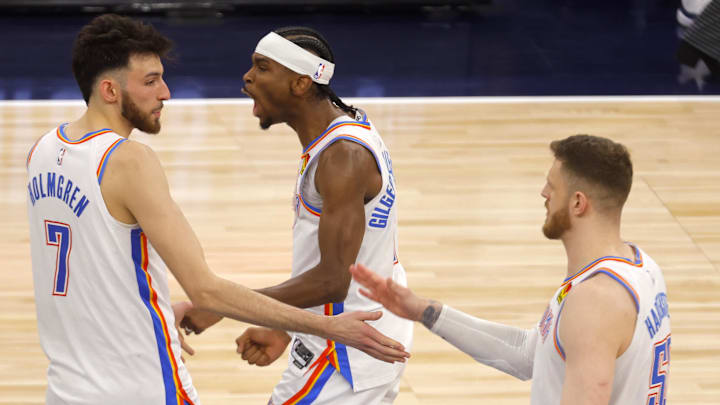 May 26, 2025; Minneapolis, Minnesota, USA; Oklahoma City Thunder forward Chet Holmgren (7), guard Shai Gilgeous-Alexander (2) and center Isaiah Hartenstein (55) react after defeating the Minnesota Timberwolves in  game four of the western conference finals for the 2025 NBA Playoffs at Target Center. Mandatory Credit: Bruce Kluckhohn-Imagn Images