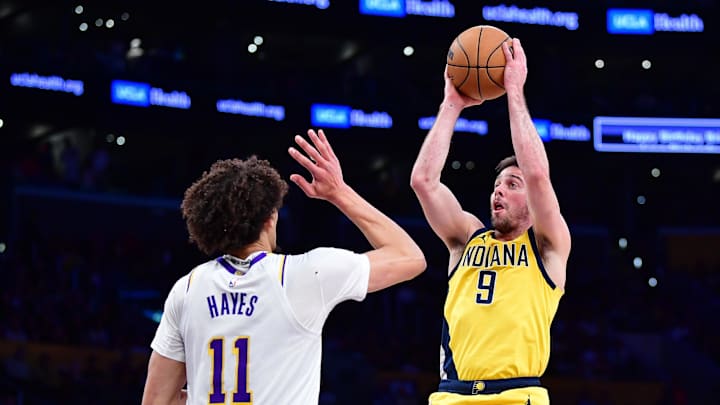 Feb 8, 2025; Los Angeles, California, USA; Indiana Pacers guard T.J. McConnell (9) shoots against Los Angeles Lakers center Jaxson Hayes (11) during the first half at Crypto.com Arena. Mandatory Credit: Gary A. Vasquez-Imagn Images