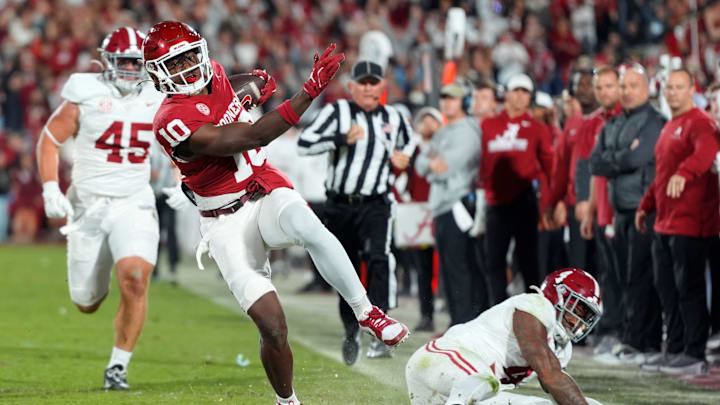 Oklahoma Sooners linebacker Kip Lewis (10) returns an interception for a touchdown in front of Alabama Crimson Tide tight end Robbie Ouzts (45) and quarterback Jalen Milroe (4) during a college football game between the University of Oklahoma Sooners (OU) and the Alabama Crimson Tide at Gaylord Family - Oklahoma Memorial Stadium in Norman, Okla., Saturday, Nov. 23, 2024