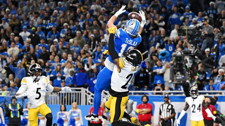 Dec 21, 2025; Detroit, Michigan, USA; Detroit Lions wide receiver Isaac Teslaa (18) attempts to catch a game winning pass but fails against Pittsburgh Steelers safety Chuck Clark (21) during the fourth quarter at Ford Field. Mandatory Credit: Lon Horwedel-Imagn Images