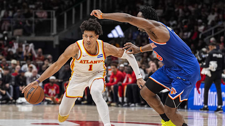 Apr 25, 2026; Atlanta, Georgia, USA; Atlanta Hawks forward Jalen Johnson (1) handles the ball guarded by New York Knicks forward Og Anunoby (8) during the second half during game four of the first round of the 2026 NBA Playoffs at State Farm Arena. Mandatory Credit: Dale Zanine-Imagn Images