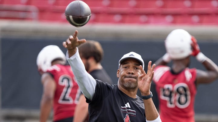 University of Louisville wide receivers coach Garrick McGee runs a drill during their second practice on Friday, Aug. 2, 2024 at L&N Federal Credit Union Stadium.