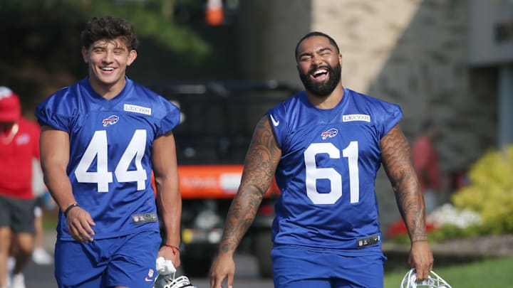 Buffalo linebacker Joe Andreessen, left, and defensive tackle Gabe Stevenson share a laugh as they walk toward the practice field.