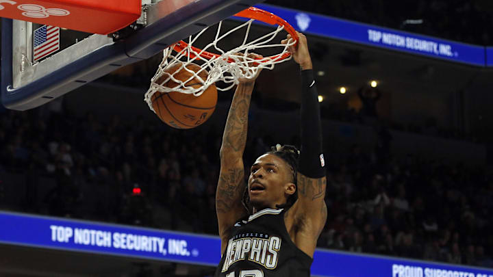 Nov 11, 2022; Memphis, Tennessee, USA; Memphis Grizzlies guard Ja Morant (12) dunks during the first half against the Minnesota Timberwolves at FedExForum. 