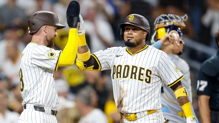 Sep 23, 2025; San Diego, California, USA; San Diego Padres designated hitter Luis Arraez (4) celebrates with second baseman Mason McCoy (18) after hitting a two-run home run during the second inning against the Milwaukee Brewers at Petco Park. Mandatory Credit: David Frerker-Imagn Images Sep 23, 2025; San Diego, California, USA; San Diego Padres designated hitter Luis Arraez (4) celebrates with second baseman Mason McCoy (18) after hitting a two-run home run during the second inning against the Milwaukee Brewers at Petco Park. Mandatory Credit: David Frerker-Imagn Images