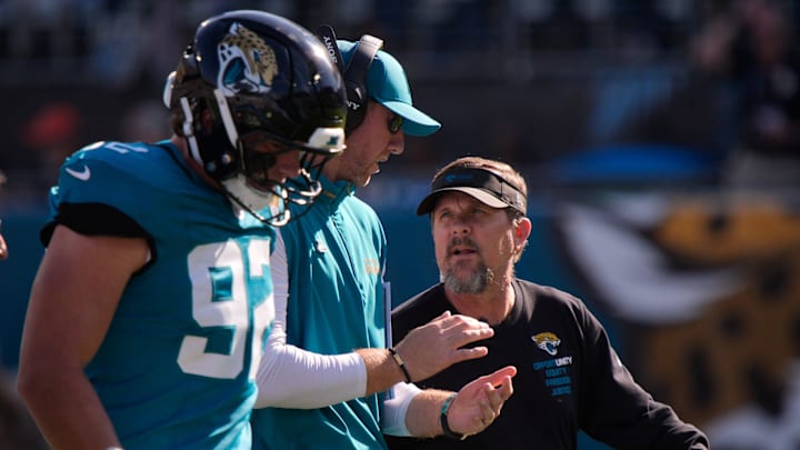 Jacksonville Jaguars head coach Liam Coen talks to one of his staff in the first quarter during an NFL football game at EverBank Stadium, Sunday, Dec. 14, 2025, in Jacksonville, Fla. [Doug Engle/Florida Times-Union]