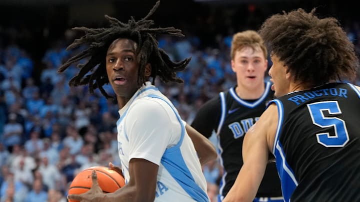 Mar 8, 2025; Chapel Hill, North Carolina, USA;  North Carolina Tar Heels guard Ian Jackson (11) with the ball as Duke Blue Devils guard Tyrese Proctor (5) defends in the second half at Dean E. Smith Center. Mandatory Credit: Bob Donnan-Imagn Images