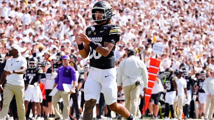 Sep 12, 2026; Boulder, Colorado, USA;  Colorado Buffaloes quarterback Julian Lewis (10) reacts following a touchdown pass in the second quarter against the Weber State Wildcats at Folsom Field.  Mandatory Credit: Ron Chenoy-Imagn Images