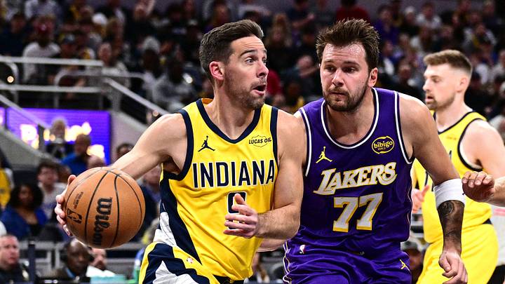 Mar 25, 2026; Indianapolis, Indiana, USA; Indiana Pacers guard T.J. McConnell (9) drives the ball past Los Angeles Lakers guard Luka Doncic (77) during the second quarter at Gainbridge Fieldhouse. Mandatory Credit: Marc Lebryk-Imagn Images Mar 25, 2026; Indianapolis, Indiana, USA; Indiana Pacers guard T.J. McConnell (9) drives the ball past Los Angeles Lakers guard Luka Doncic (77) during the second quarter at Gainbridge Fieldhouse. Mandatory Credit: Marc Lebryk-Imagn Images