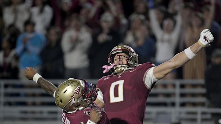 Nov 1, 2025; Tallahassee, Florida, USA; Florida State Seminoles quarterback Tommy Castellanos (1) celebrates a touchdown with wide receiver Duce Robinson (0) during the second half against the Wake Forest Demon Deacons at Doak S. Campbell Stadium. Mandatory Credit: Melina Myers-Imagn Images Nov 1, 2025; Tallahassee, Florida, USA; Florida State Seminoles quarterback Tommy Castellanos (1) celebrates a touchdown with wide receiver Duce Robinson (0) during the second half against the Wake Forest Demon Deacons at Doak S. Campbell Stadium. Mandatory Credit: Melina Myers-Imagn Images