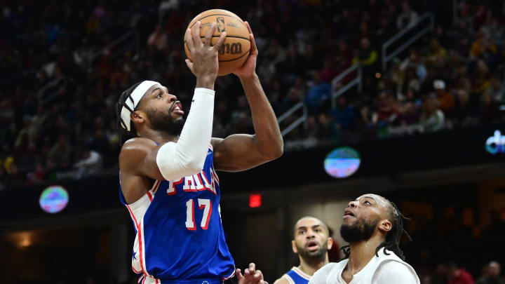 Mar 29, 2024; Cleveland, Ohio, USA; Philadelphia 76ers guard Buddy Hield (17) drives to the basket against Cleveland Cavaliers guard Darius Garland (10) during the first half at Rocket Mortgage FieldHouse. Mandatory Credit: Ken Blaze-USA TODAY Sports
