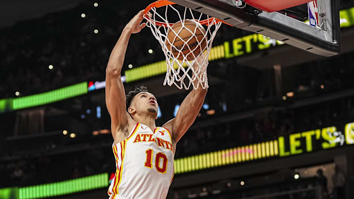 Apr 1, 2025; Atlanta, Georgia, USA; Atlanta Hawks forward Zaccharie Risacher (10) dunks against the Portland Trail Blazers during the first half at State Farm Arena. Mandatory Credit: Dale Zanine-Imagn Images