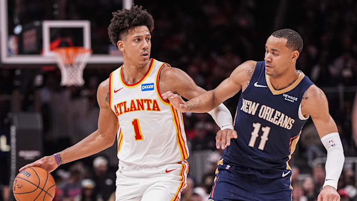 Jan 7, 2026; Atlanta, Georgia, USA; Atlanta Hawks forward Jalen Johnson (1) dribbles defended by New Orleans Pelicans guard Bryce McGowens (11) during the second half at State Farm Arena. Mandatory Credit: Dale Zanine-Imagn Images